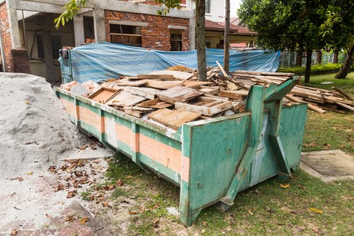 Demolition site with construction debris in Havering