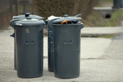 Technicians handling hazardous waste safely