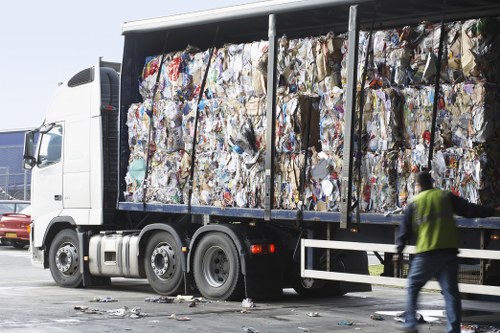 Family managing household waste with a hired skip
